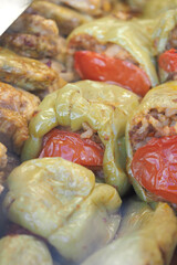 Stuffed peppers filled with meat and rice on a cooking tray