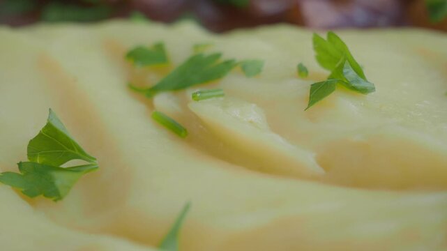 Creamy mashed potatoes with herbs and seasoning