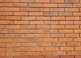 Obraz premium Close-up red brick wall background. Red brick wall panoramic