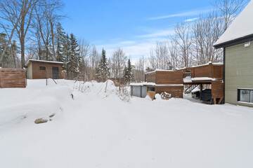 Beautiful winter landscape covered with fresh white snow, featuring pine trees and a clear blue sky. This image is perfect for travel, holiday, Christmas, New Year, nature background, seasonal design,