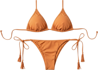 Orange bikini set with tassels and bows on white background