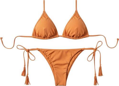 Orange bikini set with tassels and bows on white background