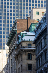 Obraz premium Canada, Montreal, 24 December 2025 : Architectural contrast between old and new buildings in urban landscape