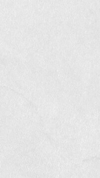 Minimalist white fine paper texture background with subtle fiber grain for clean motion graphics and video overlay.4K vertical video
