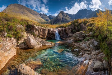 Scenic Mountain Landscape with Waterfall and Clear Blue Water Reflecting Cloudy Sky under Bright Sunlight in Tasmania Australia