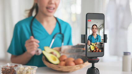 Asia woman people anti aging expert modern health care vlogger live advice talk selfie video mobile phone camera. Online diet food weight loss HDL meal plan recipe digital virtual asian coach filming.