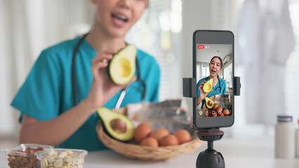 Asia woman people anti aging expert modern health care vlogger live advice talk selfie video mobile phone camera. Online diet food weight loss HDL meal plan recipe digital virtual asian coach filming.