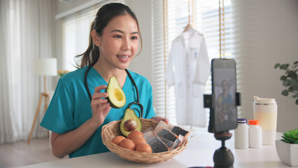 Asia woman people anti aging expert modern health care vlogger live advice talk selfie video mobile phone camera. Online diet food weight loss HDL meal plan recipe digital virtual asian coach filming.