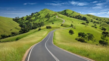 Scenic Route Winding Through Green Hills Under Blue Sky Sunny Day Asphalt Road With White Lines Leading Through Lush Green Hills Landscape With Clear Blue Sky