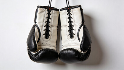 Professional boxing gloves hanging on white background