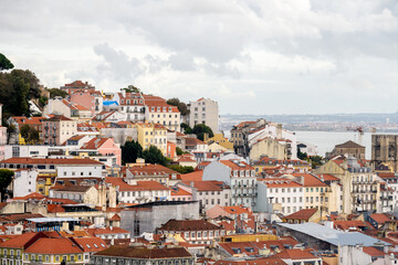 Fototapeta premium Alfama rooftops leading toward the Tagus River