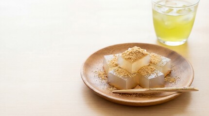 Warabi Mochi cubes with soybean powder, bamboo pick, clear refreshing look. copy space for text

