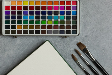 Minimal Artist Workspace with Watercolor Supplies