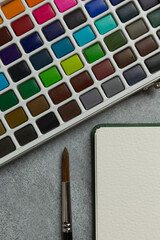 Watercolor Supplies and Empty Sketchbook Flat Lay