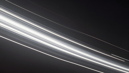 Illuminated Trajectory: An abstract visual of a collection of luminous lines streak across a dark backdrop, creating a compelling composition of light and movement. 