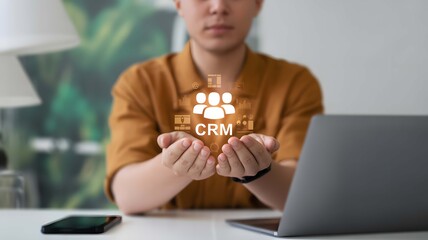 Man interacting with crm software on a laptop