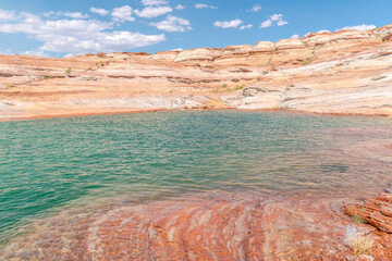 A large body of water with a rocky shoreline