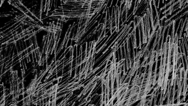 Abstract chaotic white chalk scribble texture animation on black background for creative motion graphics overlay.Stop motion animation 4k