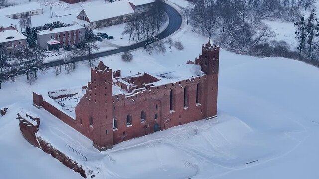 Aerial winter Teutonic Castle Radzyn Poland overhead 2. Brick Gothic monastery castle built 1234 AD, Teutonic Knights. Northern royal town.  Historical buildings. Saint Anne church 12th century.