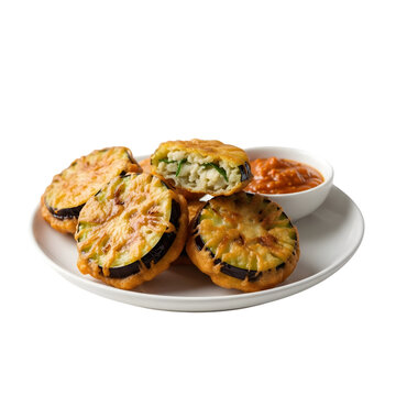 Fried eggplant slices coated in batter served with savory dipping sauce on plate