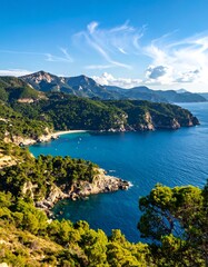 Lush cliffs meet azure sea; distant mountains, blue sky with wispy clouds