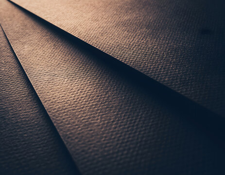 Abstract textured paper layers with dramatic lighting and shadows