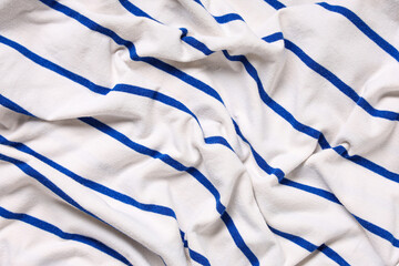 Texture of white cotton knit fabric with blue stripes as background