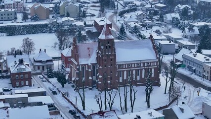 Aerial winter Teutonic Gothic church Radzyn Poland 1. Brick Gothic monastery castle built 1234 AD, Teutonic Knights. Northern royal town.  Historical buildings. Saint Anne church 12th century.