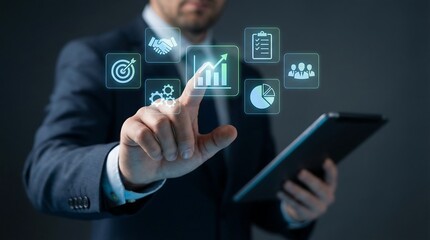 Businessman interacting with digital business icons on tablet, representing modern business strategy and innovation.