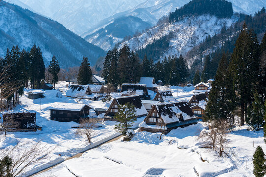 The serene and historic gassho-zukuri village of Ainokura, a UNESCO World Heritage site in Gokayama region, blanketed in winter snow. Toyama, Japan.