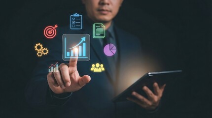Businessman analyzing data and statistics on a tablet with graphs and charts, representing business growth and success in a modern office setting.