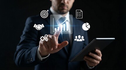 Businessman in a suit analyzing data on a tablet with infographics floating above, representing business strategy and growth.