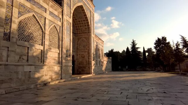 Gliding Past the Ornate Stone Facade of a Majestic Ancient Mausoleum at Golden Hour