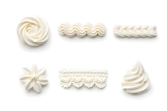 Set of Various White Whipped Cream Piping Designs Isolated on White Background