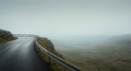 Winding Mountain Road Disappearing into Dense Fog.