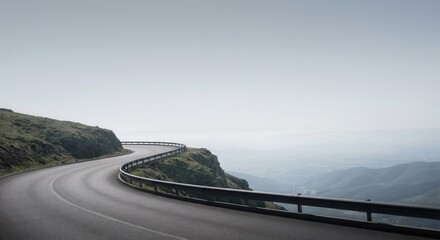 Naklejka premium Winding Mountain Road with Guardrail on a Cloudy Day.