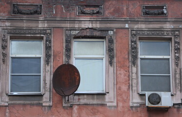 Windows with modern double-glazed windows in the wall of an old house
