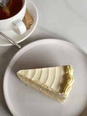 Slice of Cheesecake on White Plate