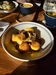 Baked cheesecakes with nuts, exposed to sunlight, angled photo