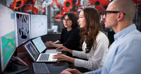 Engineering Team Creating 3D Model Of Car