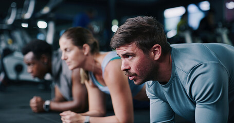 Fitness, plank and group in gym, bodybuilding and exercise to improve posture, healthy and...