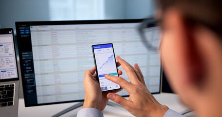 Successful Hispanic Accountant Creating Invoices Using Mobile Phone App