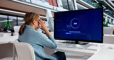 Woman Updating Computer System Software For Business