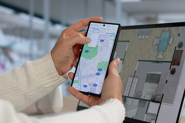 Young Woman Uses Smartphone To Search Online Real Estate Listings