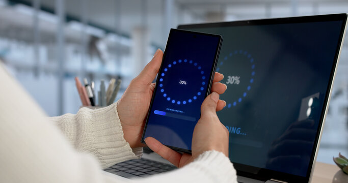 Woman Upgrading Slow OS On Mobile Smartphone