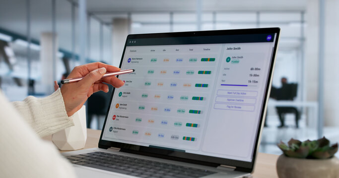 Female Business Analyst Using Employee Timetable Software