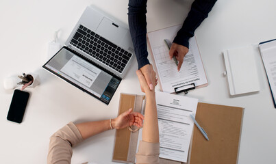 High Angle View Of Female Businesswoman Sealing Deal