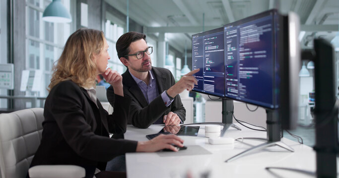 Male And Female Programmers Developing Cybersecurity Software