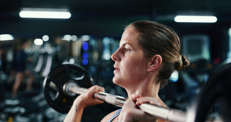Fitness, sweat and weightlifting with woman in gym for strength training or workout routine....