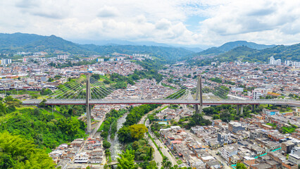 Stunning aerial view of Pereira Bridge, connecting urban areas in Risaralda, Colombia, with lush...